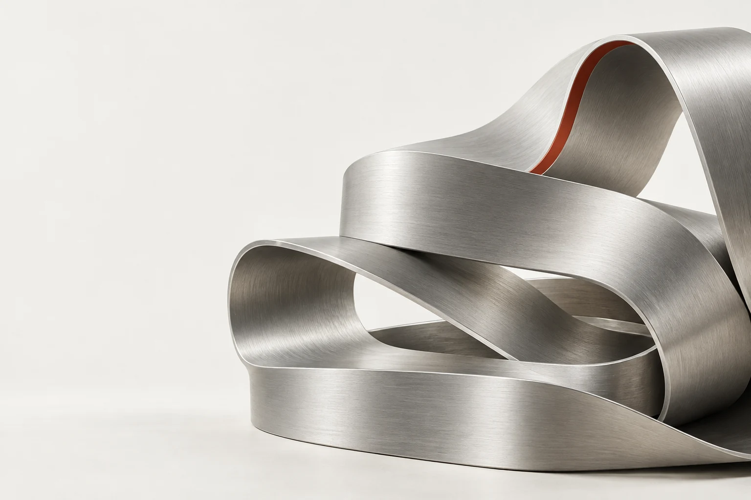 Präzise gefaltete Aluminiumschleife als Sinnbild vernetzter Prozesse